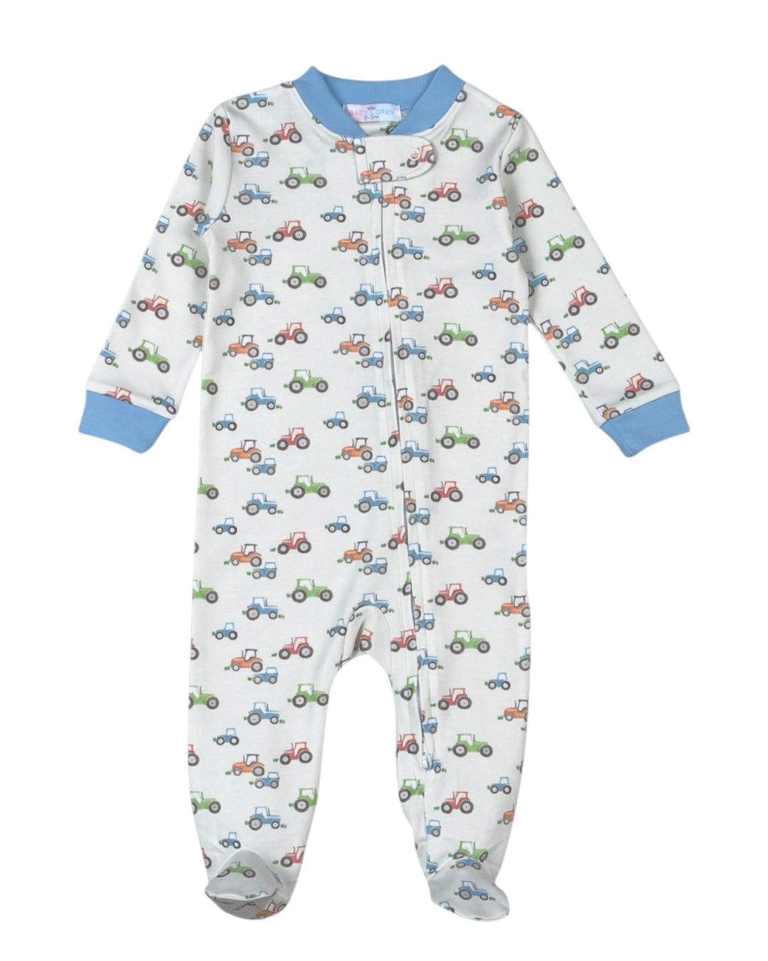 A baby footed sleeper with long sleeves and legs, featuring an all-over tractor print on a white background with light blue ribbed cuffs and collar, that store