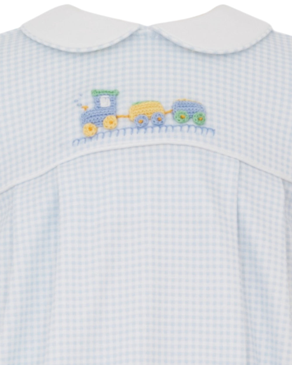 Baby outfit with blue checkered pattern and embroidered train design on a white background