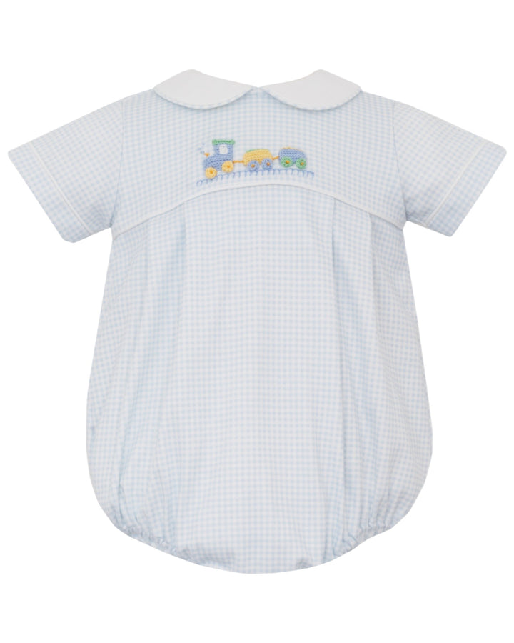 Baby romper with checkered pattern and embroidered train design on a white background