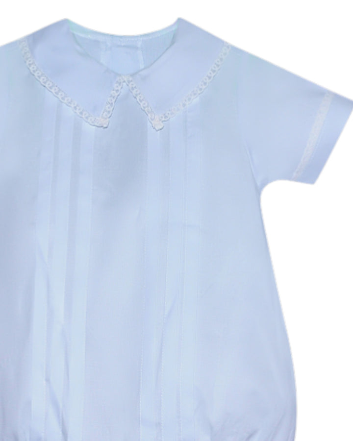 Light blue blouse with lace details on a white background