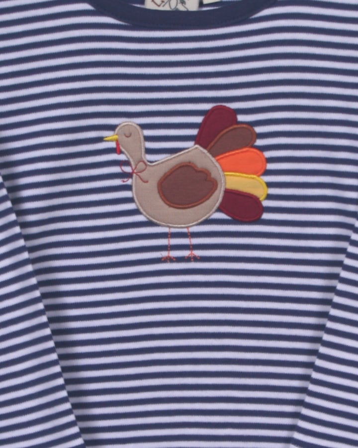 Navy and white striped shirt with a turkey applique on a blue background