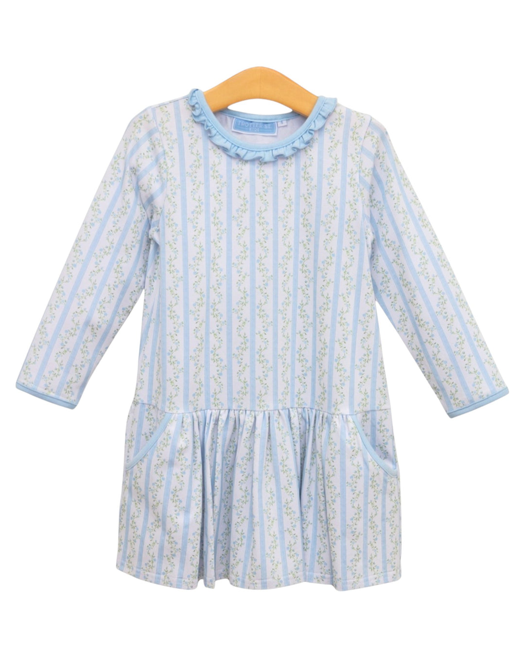 A light blue and white vertically striped long-sleeve baby dress with a ruffled collar, displayed on a wooden hanger against a white background, that store