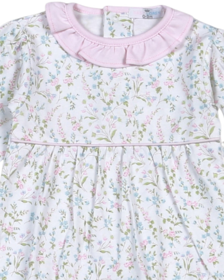Floral-patterned dress with a pink collar on a white background