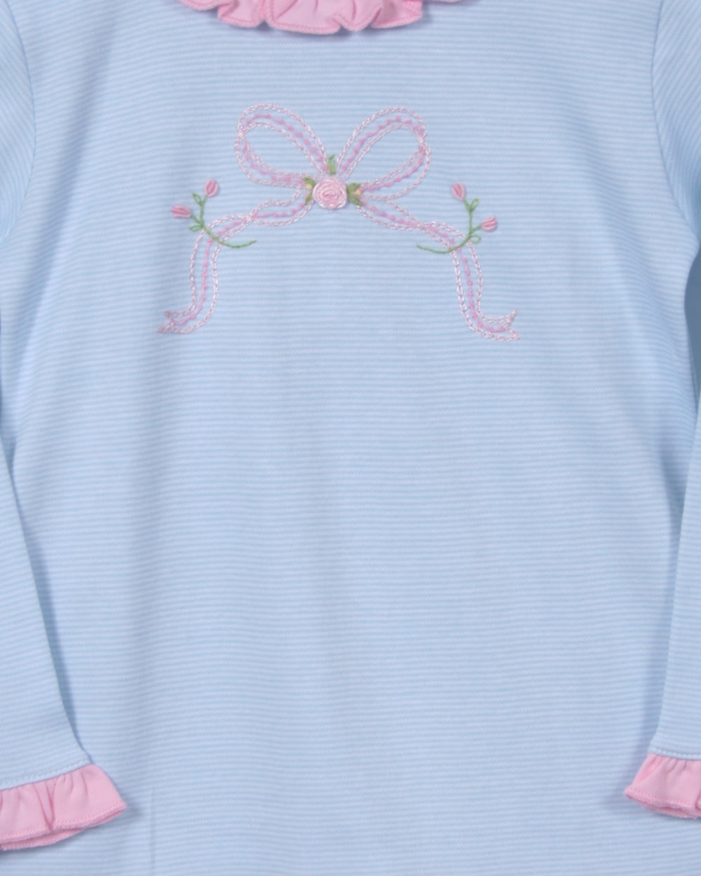 Light blue sweater with pink floral embroidery and trim