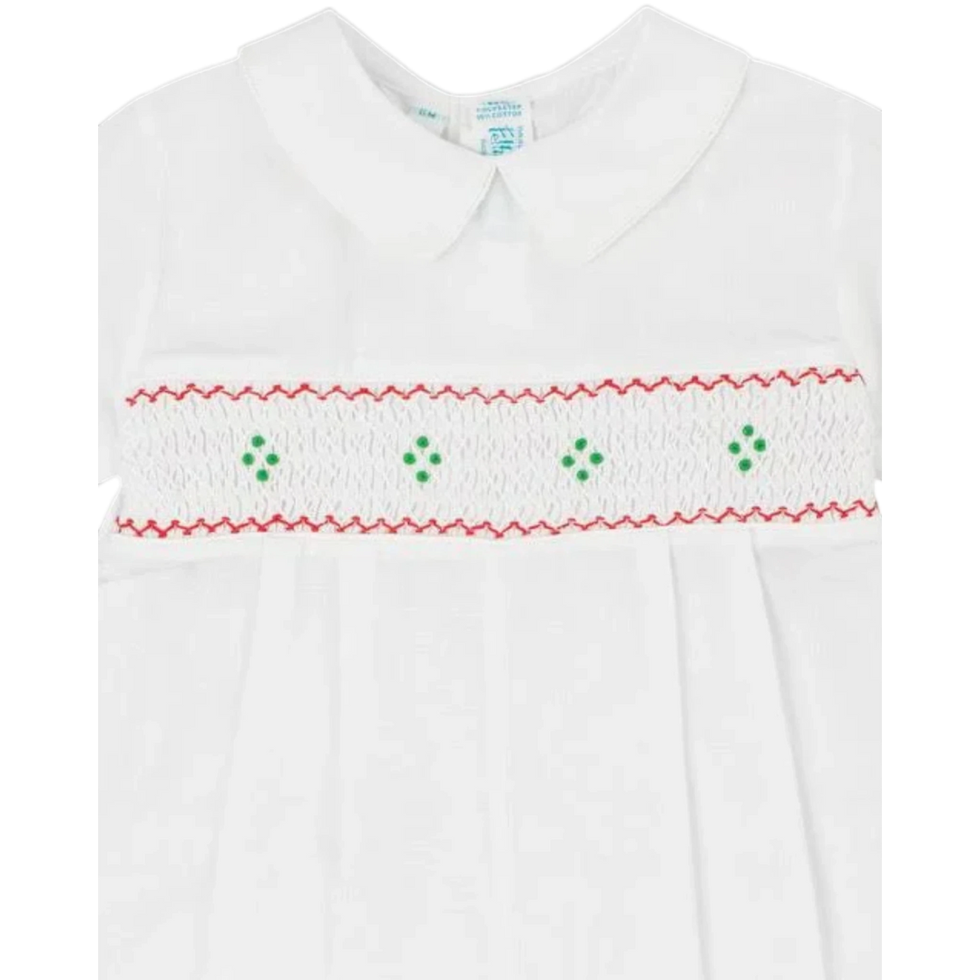 That Store boys white longall with red and green hand-smocked embroidery and a classic Peter Pan collar.