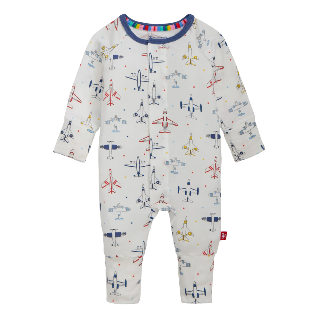 That Store Just Plane Fun modal convertible baby coverall with magnetic closures and airplane print on white fabric