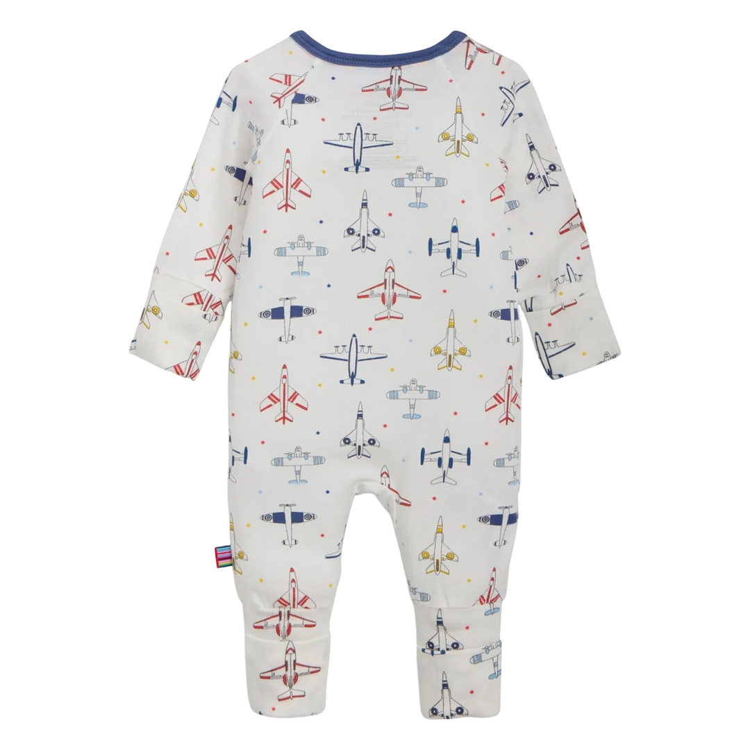 That Store modal convertible coverall in white with a colorful airplane print and magnetic closures, back view.