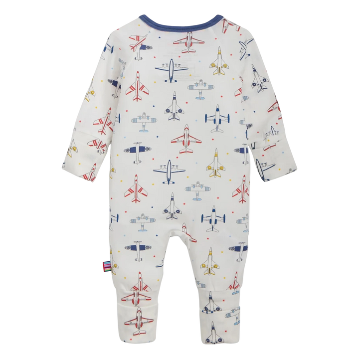 That Store modal convertible coverall in white with a colorful airplane print and magnetic closures, back view.