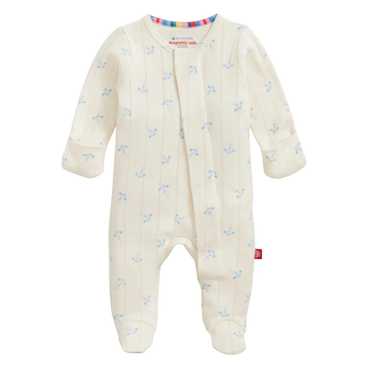That Store organic cotton pointelle magnetic footie in cream with a blue airplane print and magnetic closures.
