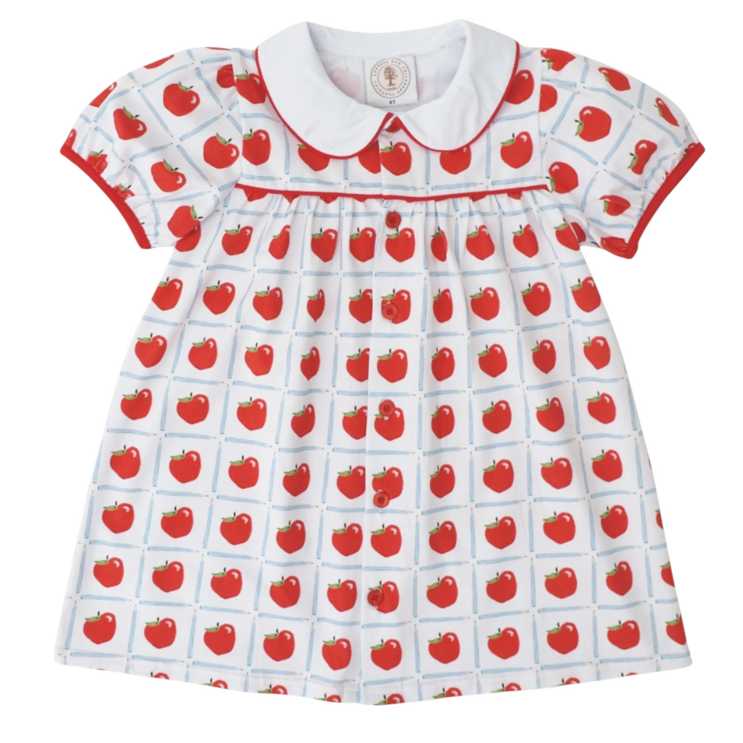 That Store Teachers Pet dress featuring a white plaid background with red apple print and a classic Peter Pan collar.