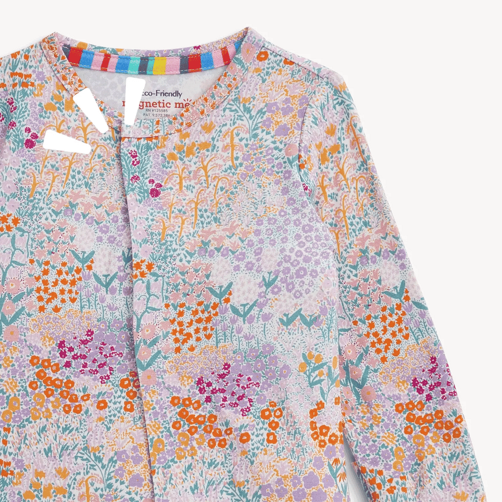 That Store Arabella modal convertible coverall featuring a colorful floral print and magnetic front closures.