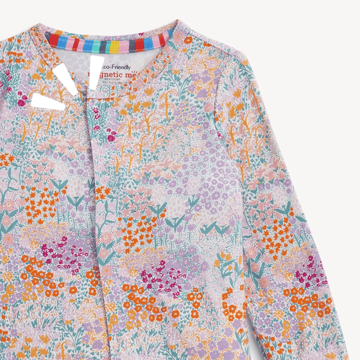 That Store Arabella modal convertible coverall featuring a colorful floral print and magnetic front closures.