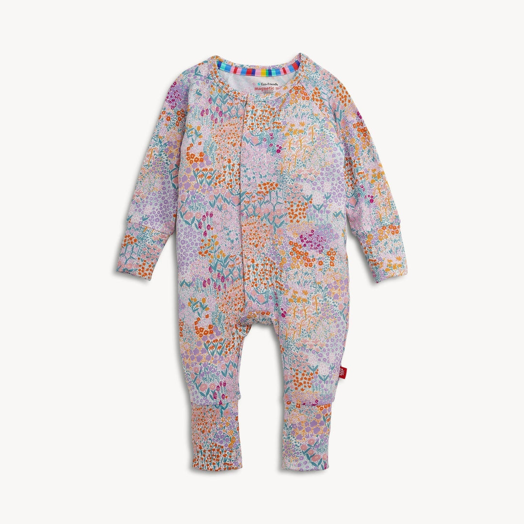 That Store Arabella modal convertible coverall in a colorful floral print with magnetic closures and foldover cuffs.