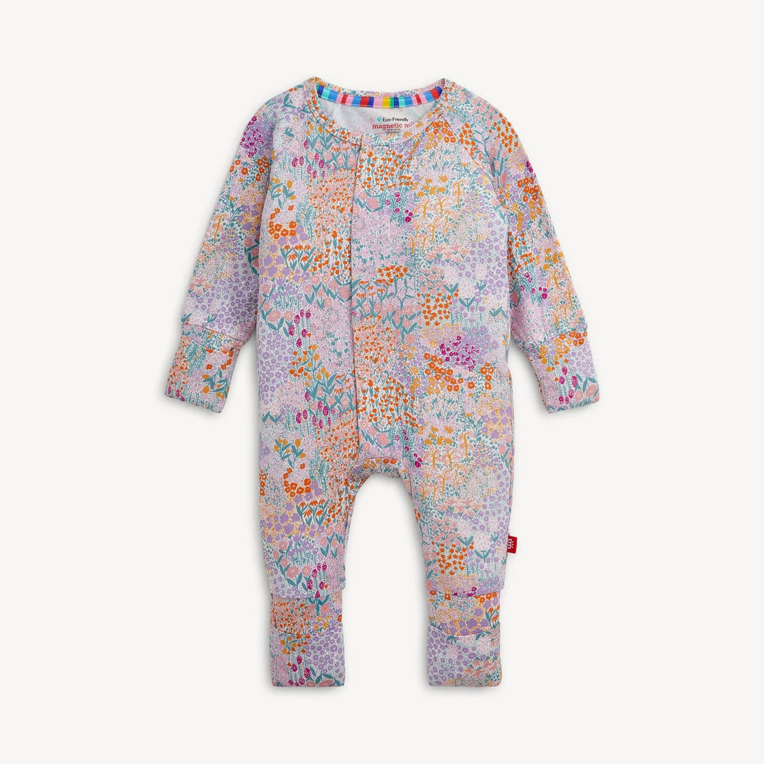 That Store Arabella modal convertible coverall with a colorful floral print, magnetic closures, and foldover cuffs.