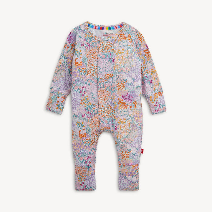 That Store Arabella modal convertible coverall with a colorful floral print, magnetic closures, and foldover cuffs.