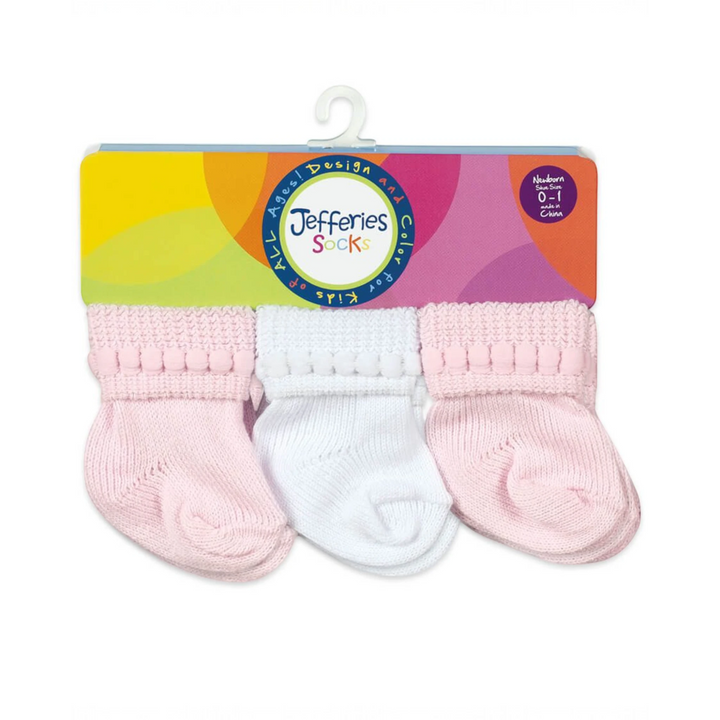 That Store baby socks in pink and white with bubble stitch cuffs, cotton-rich newborn booties in a 6 pair pack.