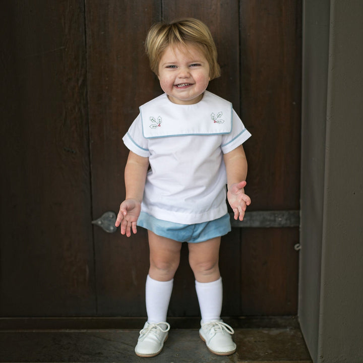 That Store boys Beaufort blue velvet shirt and bloomer set featuring white collar with festive holly embroidery