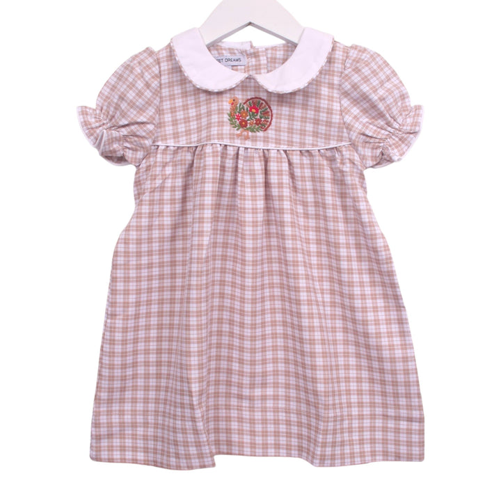 That Store beige and white plaid toddler dress with a white Peter Pan collar, puff sleeves, and turkey embroidery.