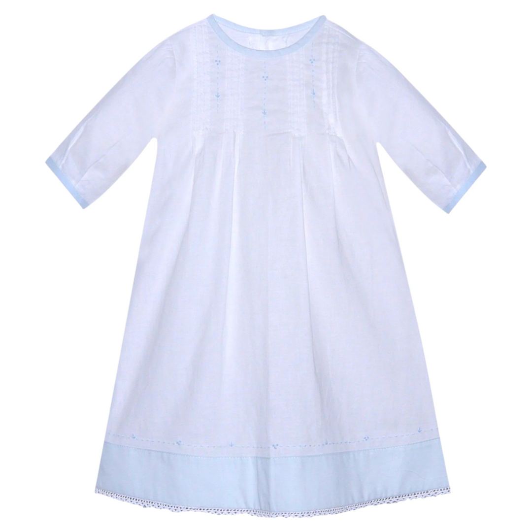That Store Blaine boys daygown in white with blue trim, featuring delicate embroidery and a classic round neckline.