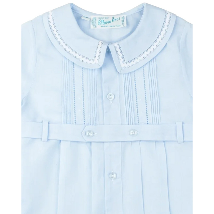 That Store baby boy blue creeper with ric-rac collar, pintucks, and button-down tuxedo belt detail.