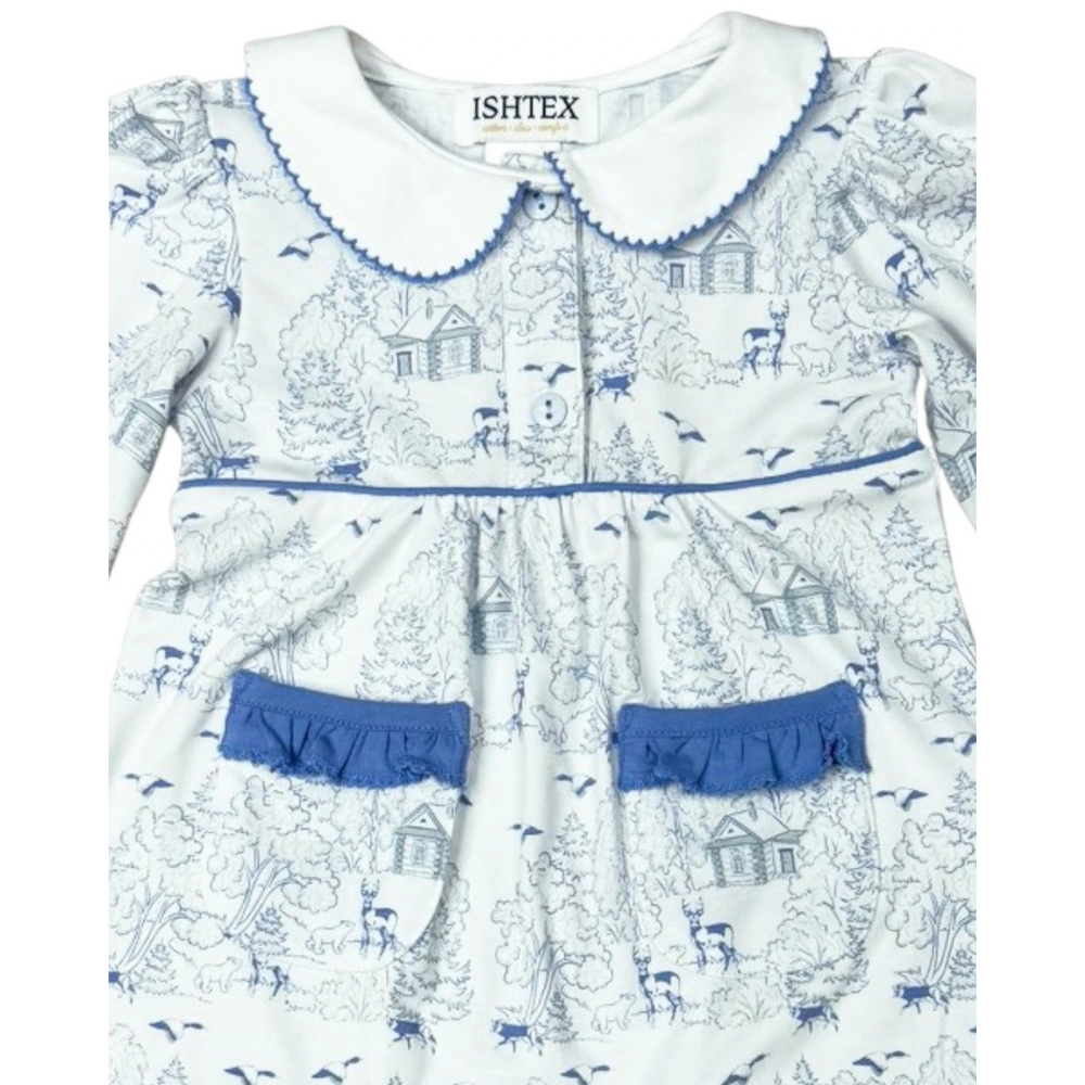 That Store girls romper in white with blue log cabin and forest print, featuring a peter pan collar and pockets.