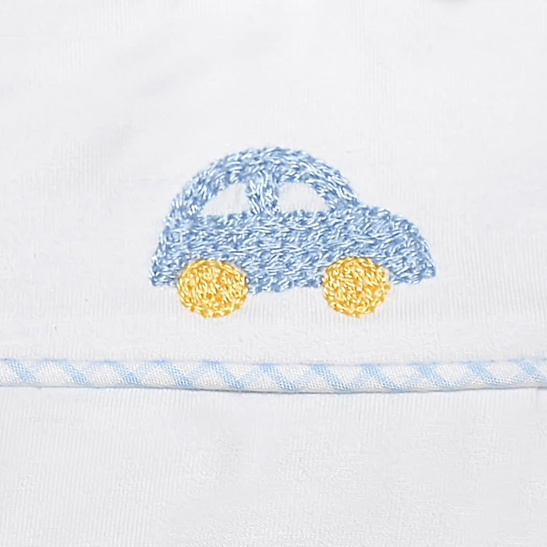 That Store baby diaper set featuring a hand-embroidered blue car with yellow wheels on crisp white fabric