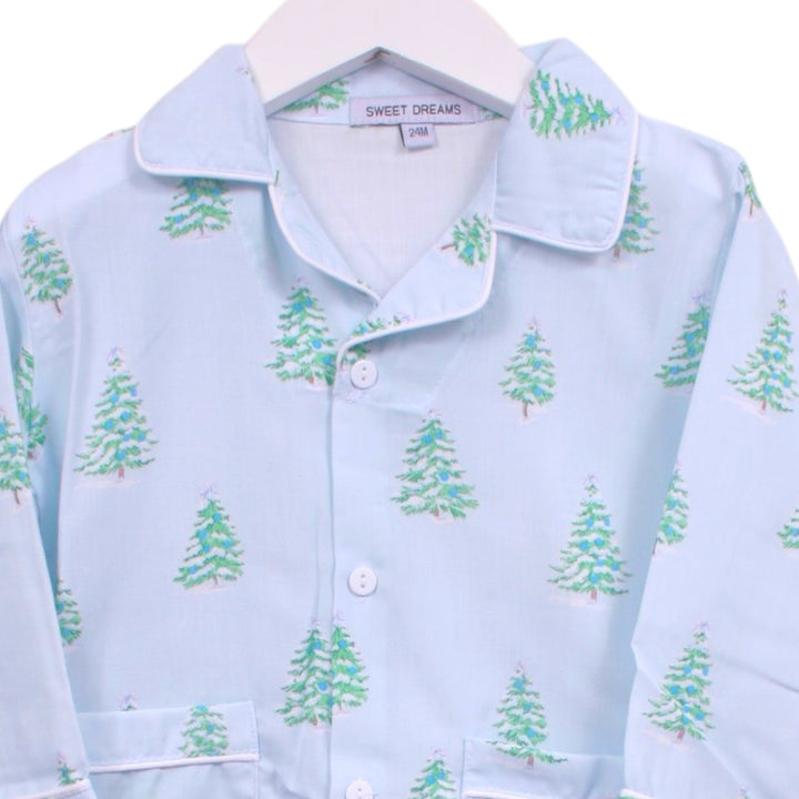 That Store light blue boys pajama top with a whimsical green Christmas tree print and white piping detail.