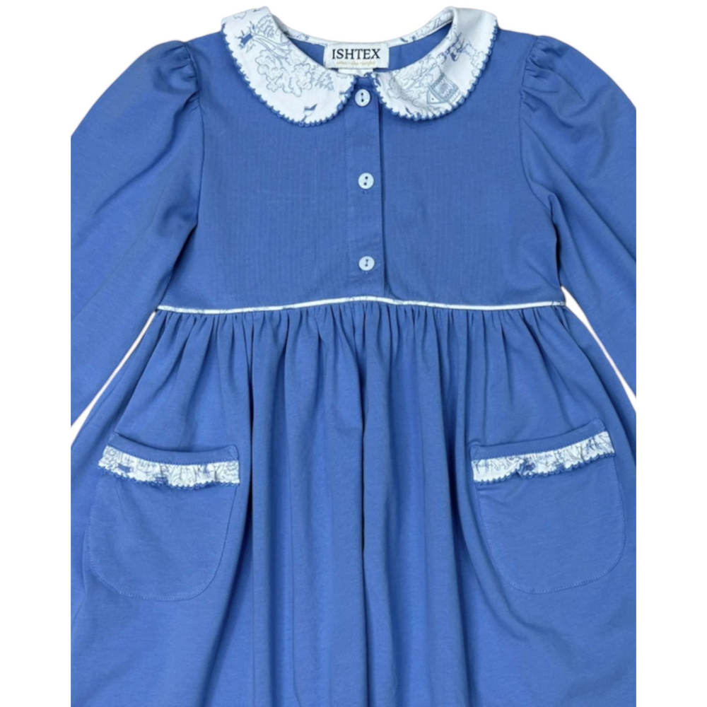 That Store girls blue cotton dress with white peter pan collar and pocket trim featuring a playful toile print.
