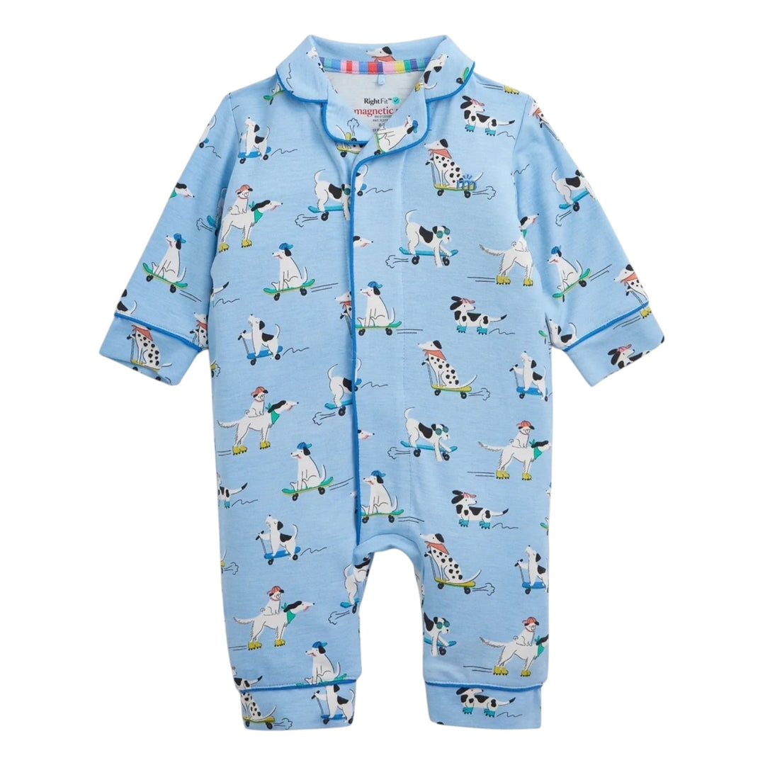 That Store baby coverall in light blue with a playful dog on skateboard print, featuring magnetic closures.