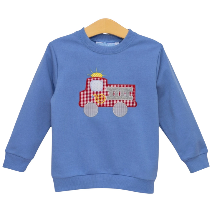 That Store blue French terry pullover for boys featuring a red gingham fire truck applique design
