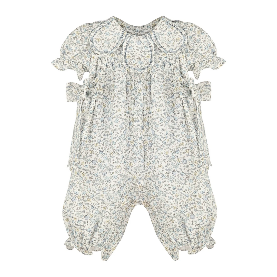 That Store girls blue floral longall featuring a petal-inspired collar and ruffled sleeves in a classic one-piece cut.