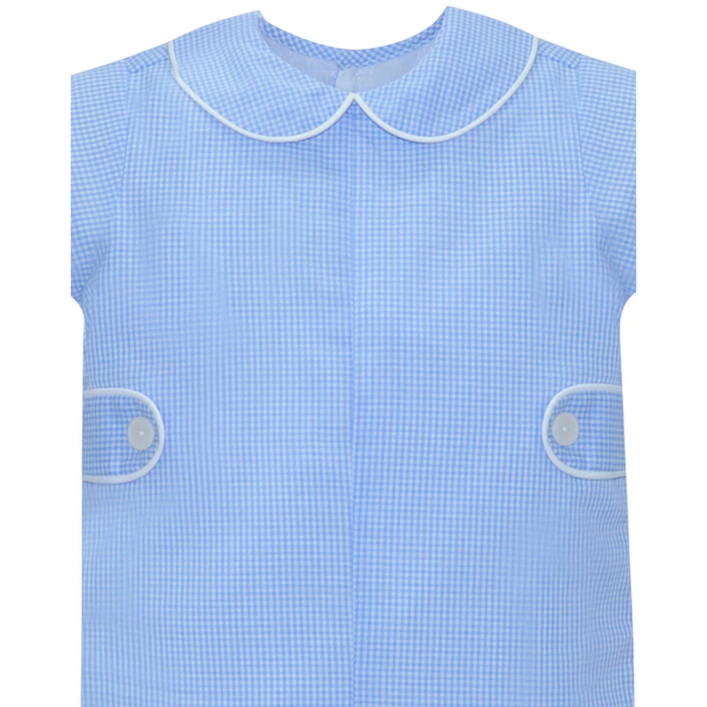 That Store blue gingham boys romper with a peter pan collar, white piping, and side button tabs in poly-cotton blend.