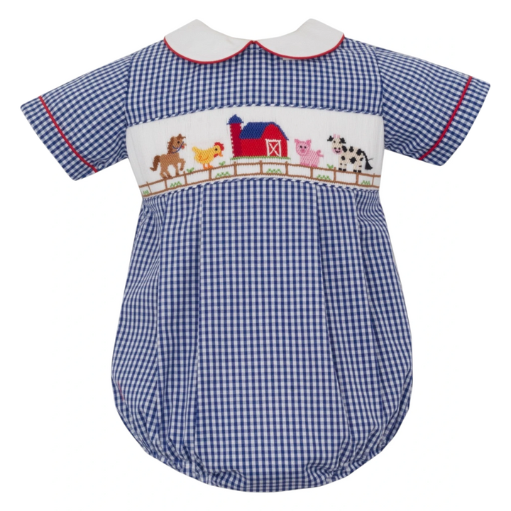 That Store blue gingham boys bubble with hand-smocked farm animal embroidery and a white Peter Pan collar.