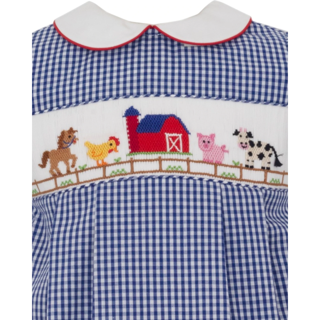 That Store boys blue gingham bubble with hand-smocked farm animal embroidery and a red-trimmed white collar