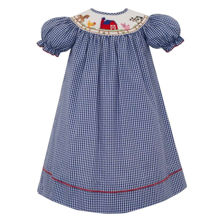 That Store blue gingham bishop dress with farm animal smocking, puff sleeves, and red trim detail.