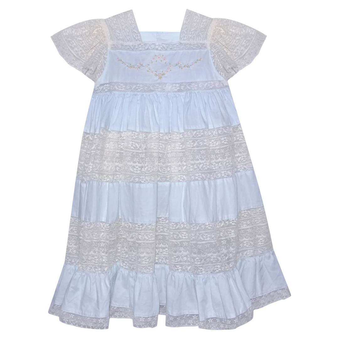 That Store Mary Frances blue cotton heirloom dress with intricate lace panels and delicate floral embroidery.