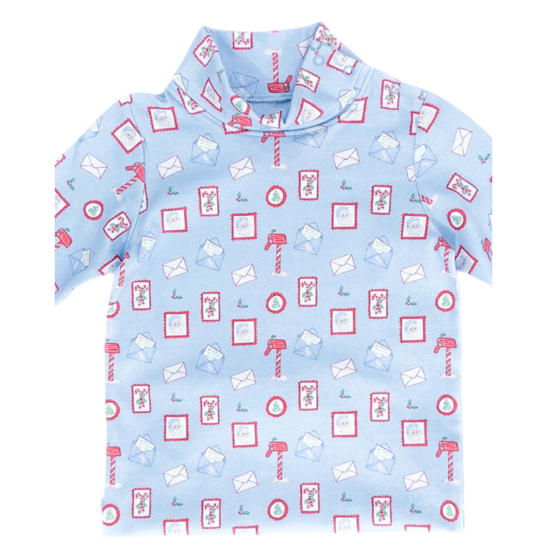 That Store light blue turtleneck featuring a festive Letters to Santa print with mailboxes, envelopes, and Santa.