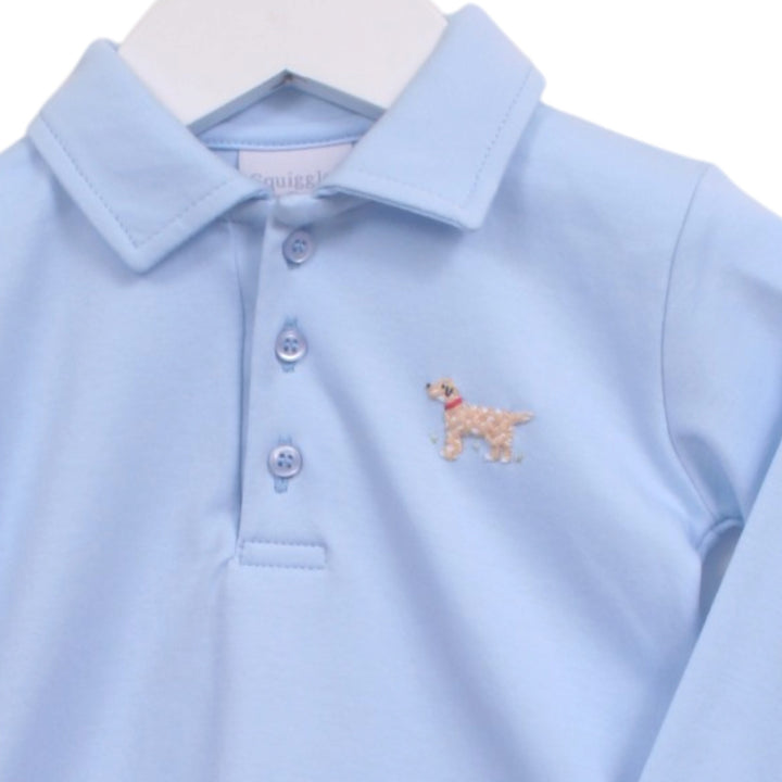 That Store light blue long sleeve polo shirt for boys with a small embroidered dog detail on the chest.