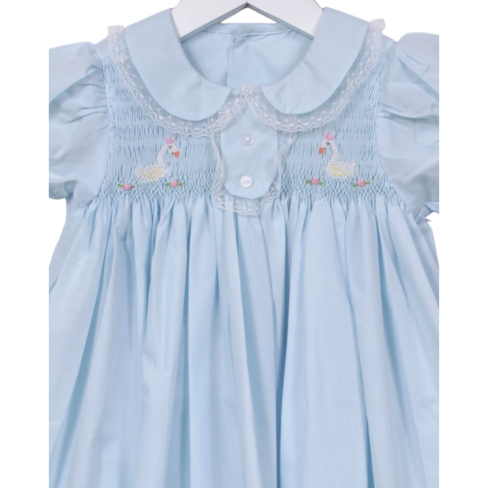 That Store light blue smocked dress with white lace collar and embroidered swan detailing for little girls
