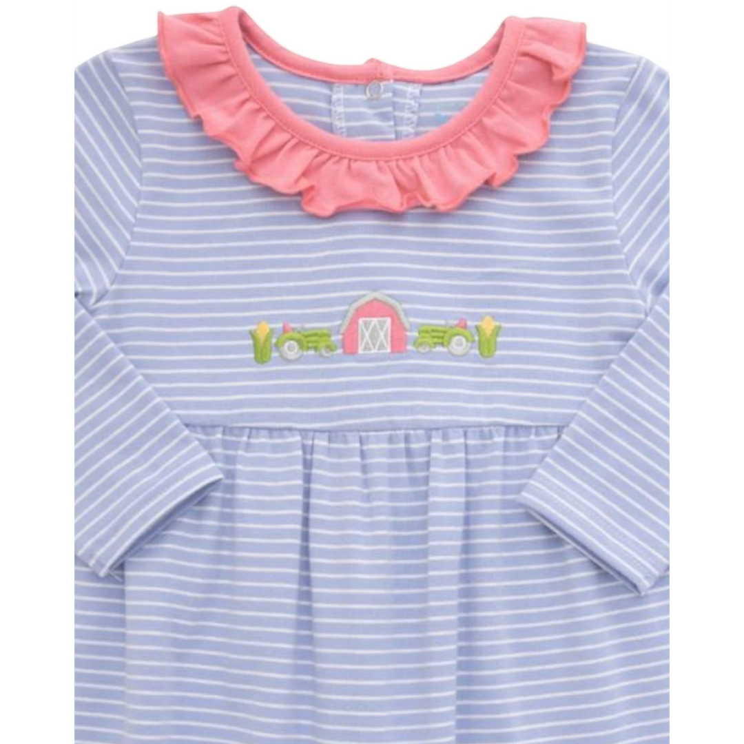 That Store girls blue striped romper featuring a pink ruffled collar and embroidered farm tractor and barn detail.