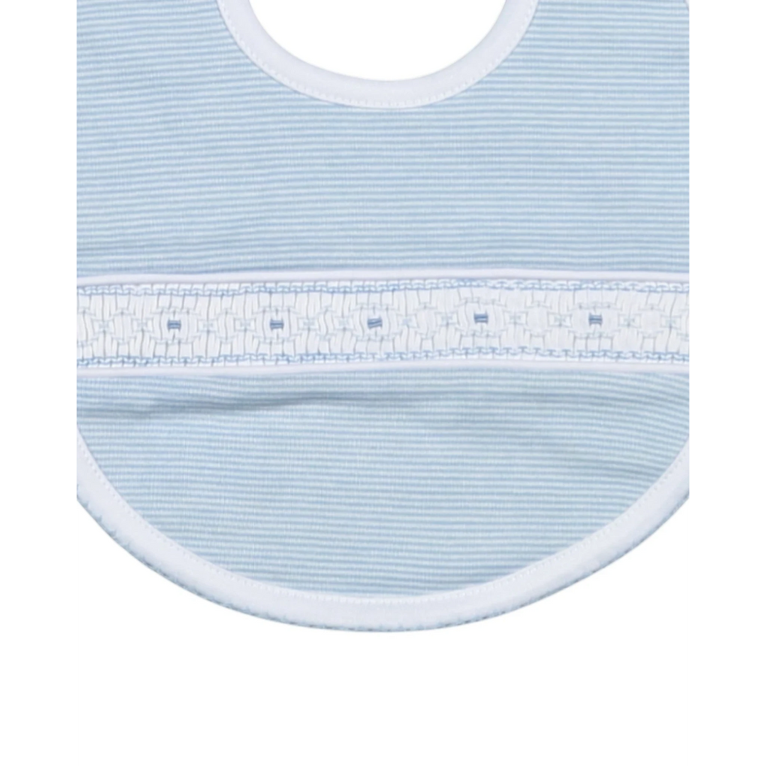 Close-up of a light blue baby bib with white trim on a white background