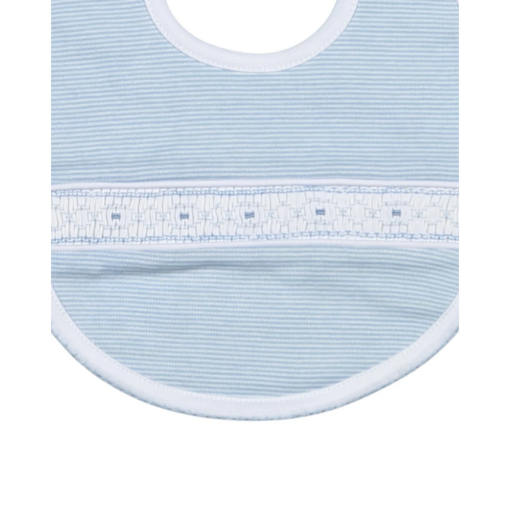Close-up of a light blue baby bib with white trim on a white background