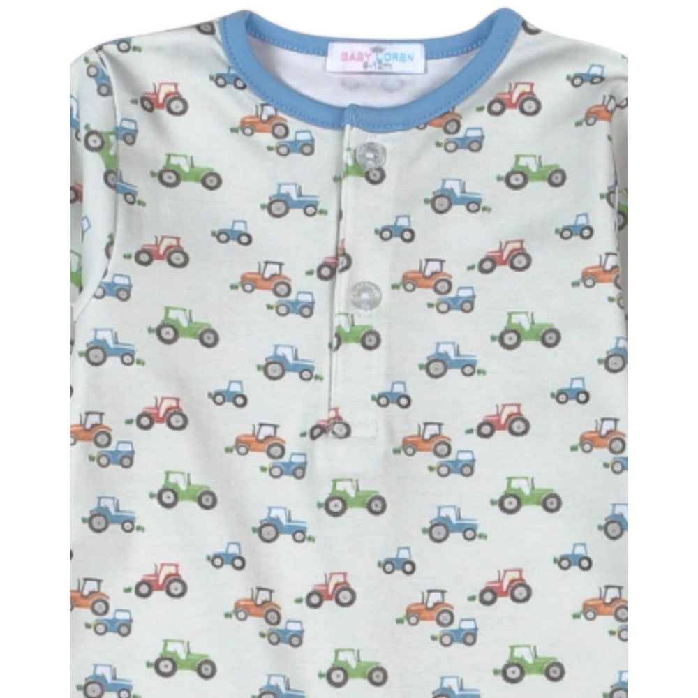 That Store boys romper in blue Pima cotton with a colorful tractor print and a button-front neckline
