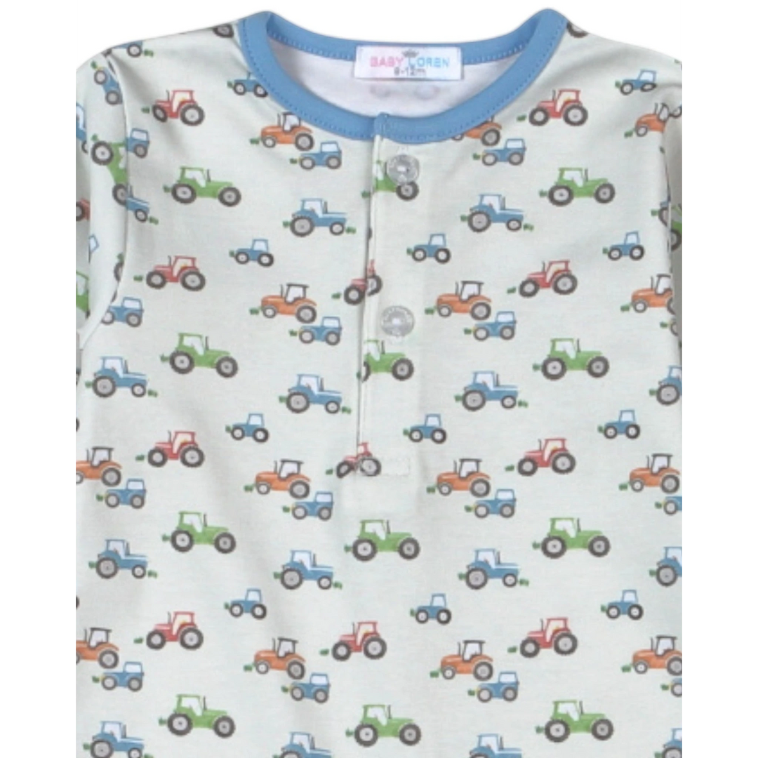 That Store boys romper in blue Pima cotton with a colorful tractor print and a button-front neckline
