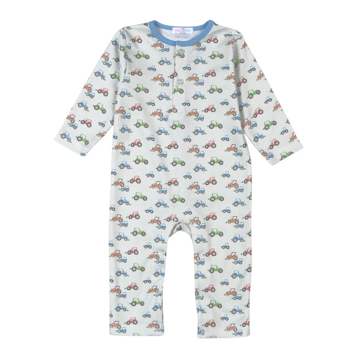 That Store Pima cotton baby romper in blue with a colorful tractor print and long sleeves for active boys.