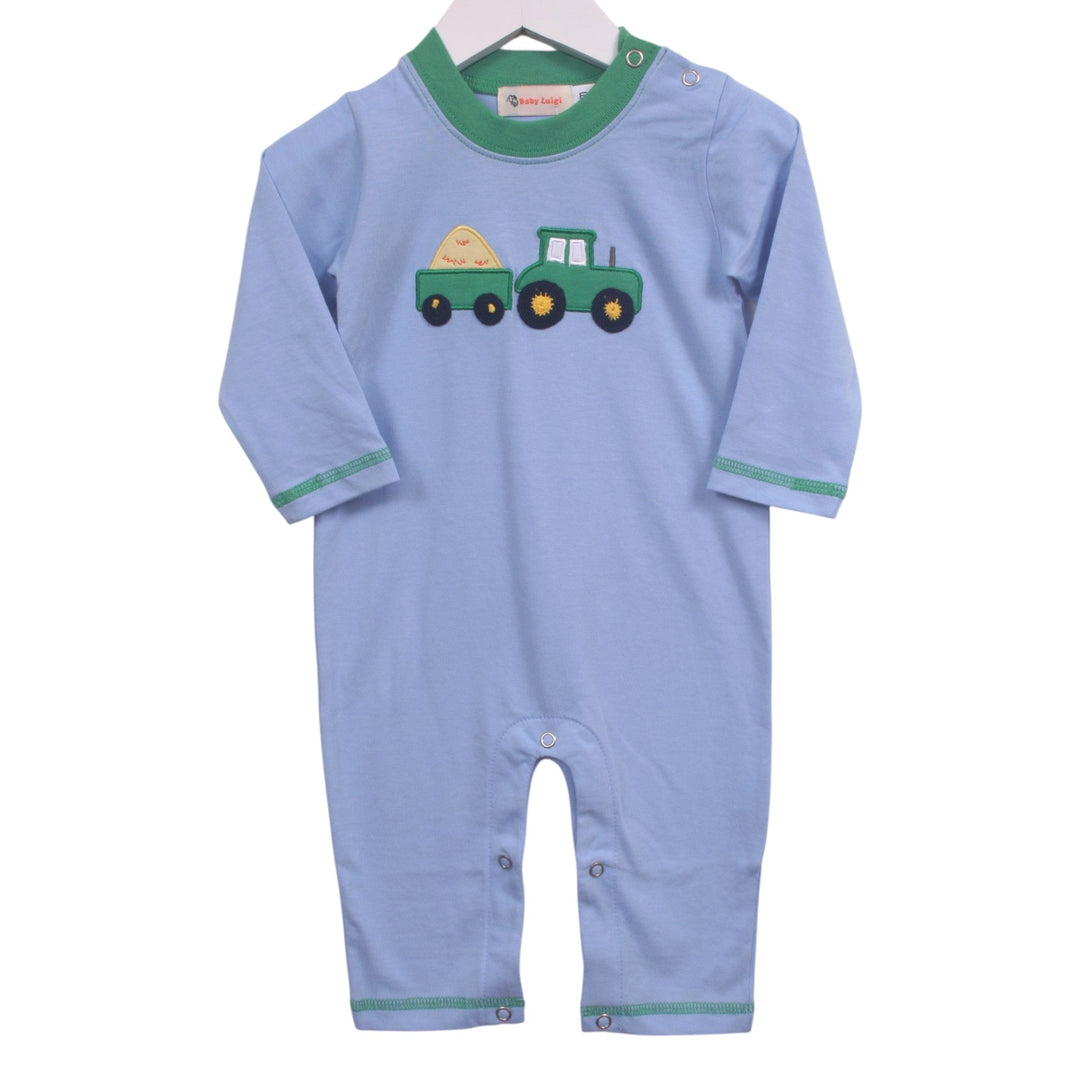 That Store blue cotton baby romper with green trim and a tractor and hay baler appliqué for boys