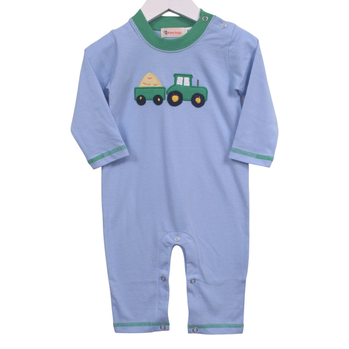 That Store blue cotton baby romper with green trim and a tractor and hay baler appliqué for boys