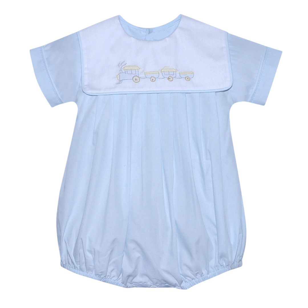 That Store blue baby boy bubble romper featuring a white collar with an embroidered train design and snap closures.