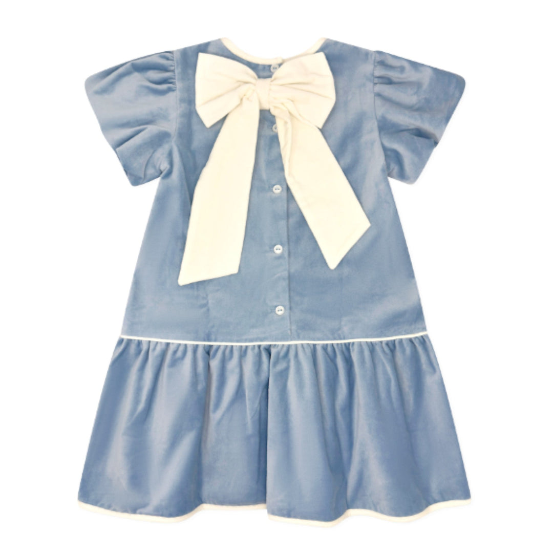 That Store girls Beaufort blue velvet dress featuring a drop waist and a large winter white bow on the back.