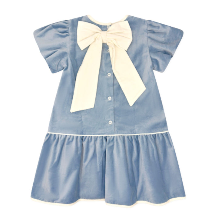 That Store girls Beaufort blue velvet dress featuring a drop waist and a large winter white bow on the back.